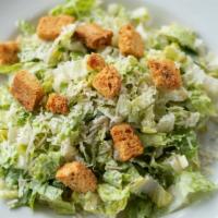 Caesar Salad · Crisp romaine lettuce tossed in Caesar dressing.