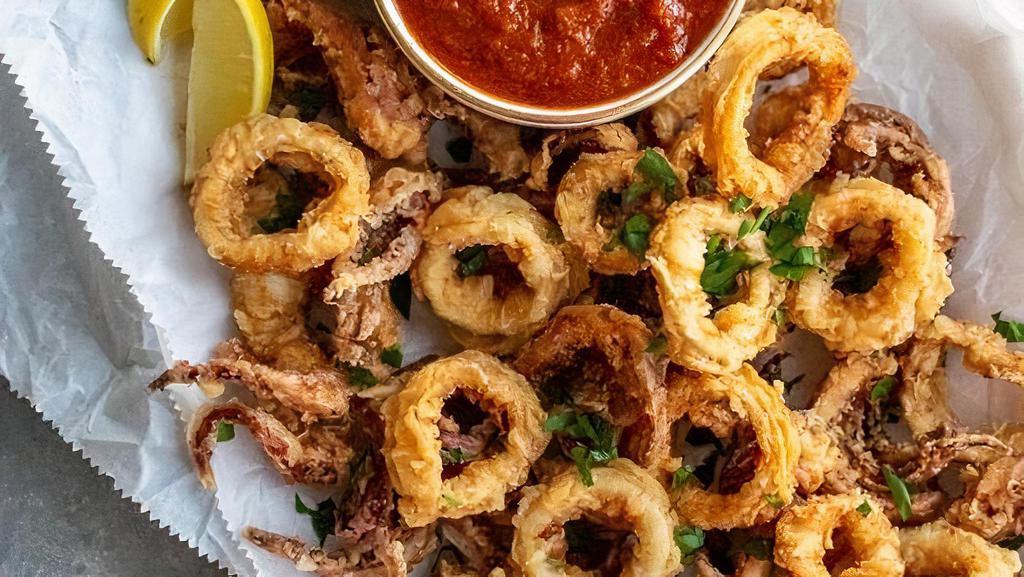 Fried Calamari · Battered Calamari rings served with fresh lemon & house marinara sauce