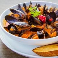 Mussels Fra Diavlo · Fresh Muscles sauteed in a spicy tomato broth.