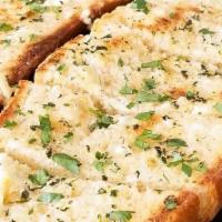 Garlic Bread Wedge · Opened wedge covered in garlic, oil, spices. Top with melted mozzarella for $1 more
