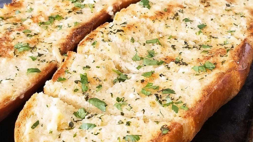 Garlic Bread Wedge · Opened wedge covered in garlic, oil, spices. Top with melted mozzarella for $1 more