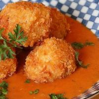 Arancini/Rice Balls · Rice balls made with, Zucchini, Eggplant & Mozzarella Served with a Vodka dipping sauce