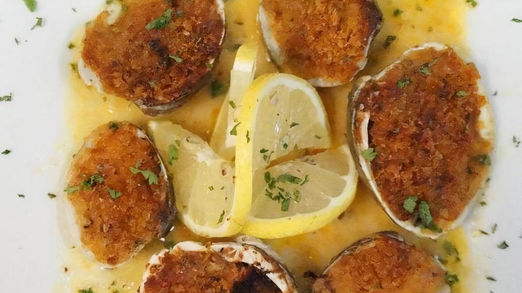 Clams Oreganata · Breadcrumbs, fresh herbs, roasted garlic & brown butter. Served with a lemon & white wine sauce