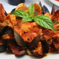 Seafood Linguini Fra Diavolo* · Clams, Mussels shrimp & Calamari in a light tomato broth