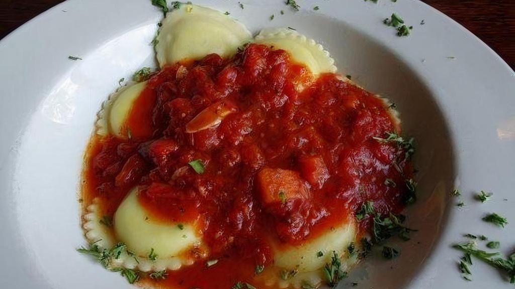 Cheese Ravioli · Cheese Ravioli topped with tomato sauce, a classic Italian feel-good dish.