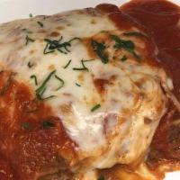 Homemade Meat Lasagna · Beef & Veal Ragu covered in mozzarella & Bechamel sauce