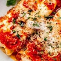 Manicotti · (4) Delicious ricotta wrapped in fresh pasta sheets topped with tomato sauce and melted mozz...