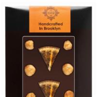 Dark Chocolate Large Bar - Hazelnut & Orange · Kosher, vegan, gluten free. Kosher parve • vegan • gluten-free.

56% pure dark belgian choco...