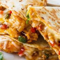 Shrimp Quesadilla  · Grilled shrimp, shredded mozzarella cheese, sautéed mixed bell peppers and avocado served wi...