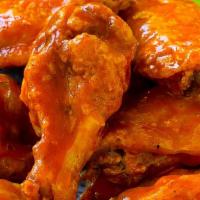 Buffalo Chicken Wings · 7 pieces wings of a chicken coated in sauce and served with blue cheese dressing.