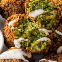 Falafel Appetizer  · 5 pieces of Falafel balls served with pita bread and side of hummus.