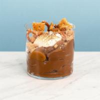 S'Mores Pud · Decadent chocolate pudding topped with salty brown butter grahams, toasted nougat, caramel a...