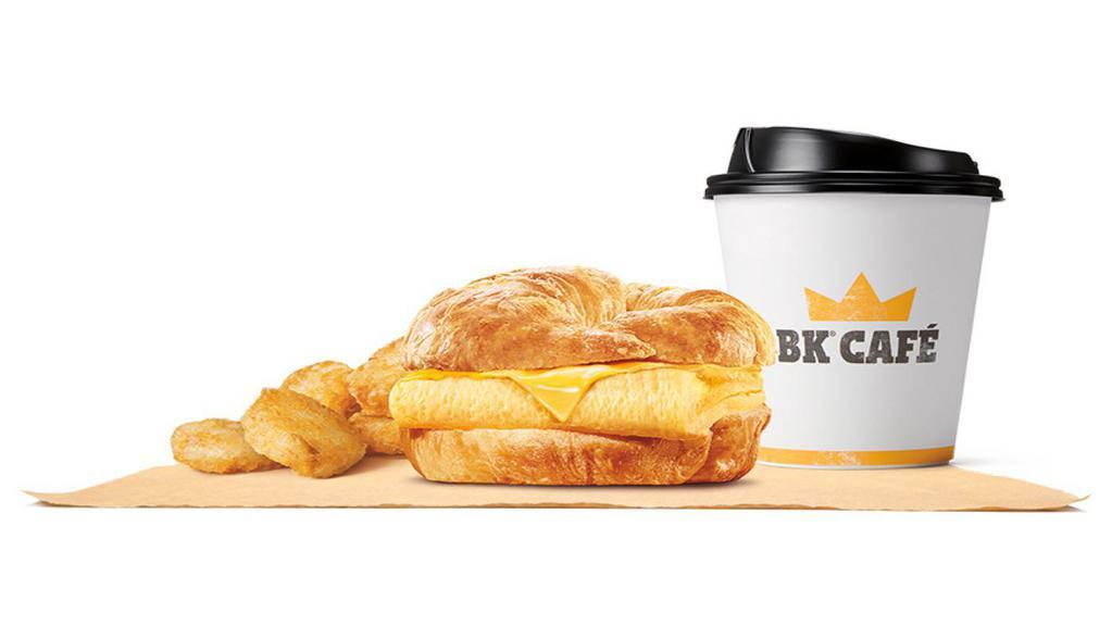 Egg & Cheese Croissan Wich® Meal · Rise and shine with our Egg & Cheese CROISSAN’WICH® is now made with 100% butter for a soft, flaky croissant with fluffy eggs and melted American cheese. Meal comes in medium and large sizes. Served with Hash Browns, your choice of Drink.