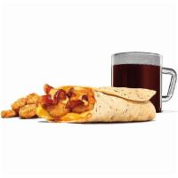 Egg-Normous Burrito™ Meal · Featuring a generous serving of thick-cut smoked bacon, lots of fluffy eggs, topped with Que...