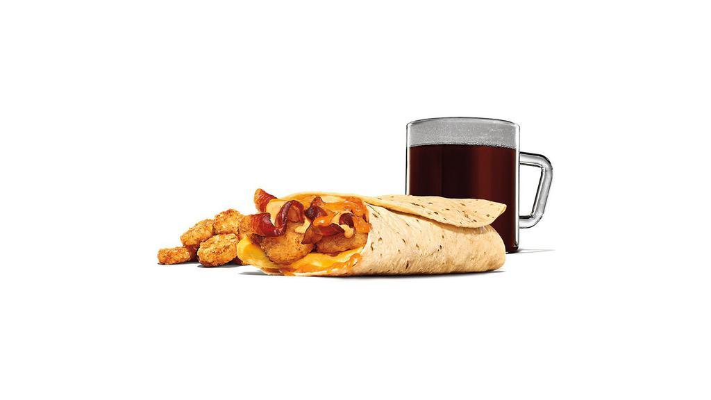 Egg-Normous Burrito™ Meal · Featuring a generous serving of thick-cut smoked bacon, lots of fluffy eggs, topped with Queso sauce, golden hash browns, plus a creamy spicy sauce all wrapped up in a warm flour tortilla and served with a side of Picante Sauce.