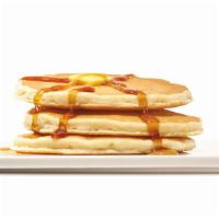 Pancakes · Fresh from the kitchen, three fluffy pancakes drizzled in sweet syrup.