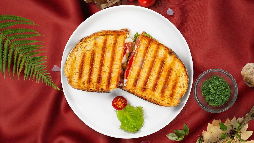 Italian Panini · Panini filled with grilled chicken, fresh mozzarella, and roasted peppers.