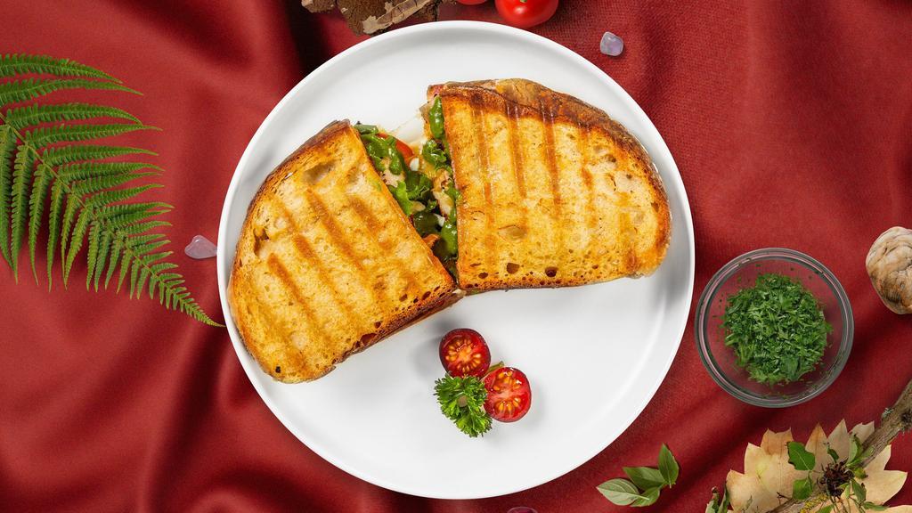 Chicken Fajita Panini · Panini filled with grilled chicken, cheddar cheese, roasted pepper, onion and hot sauce.