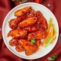 Buffalo Wings · Fresh chicken wings breaded, fried until golden brown, and tossed in buffalo sauce.