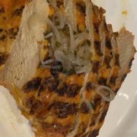 Pan Con Pollo Frito · Crispy chicken thighs, lotus leaf steamed bun, pickled jalapeno, criollo aioli, iceberg.