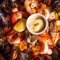Paella Valenciana · Saffron rice, shrimp, bay scallops, mussels, clams, chorizo, chicken, garlic aioli.