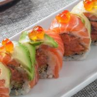 *Spicy Titanic Roll · Salmon, avocado and tobiko caviar, wrapped around crunchy spicy tuna