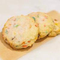 Fruity Pebble Sugar Cookie · Fruity pebbles topped with unicorn dust