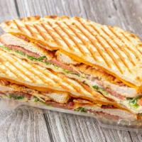 Chicken Parm Panini · Breaded chicken, mozzarella, marinara, basil, and parmesan cheese.