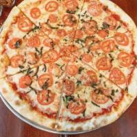 Margherita Pizza · Sliced tomatoes, fresh basil, garlic, oregano, mozzarella, and romano.