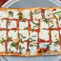 Grandmas Pan Pizza · Fresh crushed tomatoes, fresh mozzarella, basil, grated pecorino, and oregano. Topped off wi...