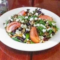 Compo Salad · Baby field greens and tomatoes, topped with dried cranberries, gorgonzola cheese, and choppe...