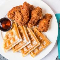Chicken & Waffles · Crispy fried chicken paired with belgian waffles, served with Vermont maple syrup and locall...