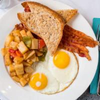 Traditional American Breakfast · Two eggs any style, bacon, home fries and toast.