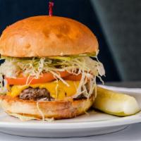 Classic Park Burger · Certified angus beef patty, topped with shredded iceberg, sliced pickles, tomatoes, and hous...