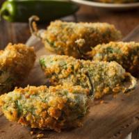 Jalapeño Poppers · 6 pcs crispy golden deseeded jalapeño stuffed with creamy cheese.