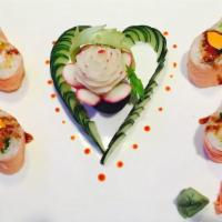 Sweetheart Roll · Shrimp tempura, spicy tuna & avocado with seaweed salad wrap with soy wrap.