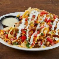 Mini- Mex Tex-Mex Chicken Nachos · a smaller portion, with big, bold. flavors. Monterey Jack and cheddar cheeses, tortilla chip...