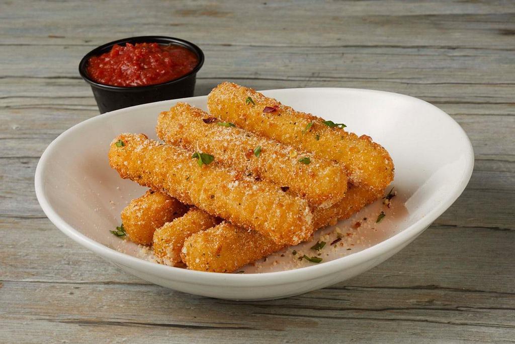 Half Mozzarella Sticks · 6 Mozzarella sticks tossed in a blend of Parmesan, garlic and oregano. Served with zesty marinara..