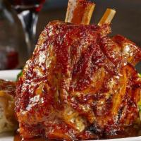 Pork Osso Buco · Marinated, slow-cooked shank, mashed potatoes, rich brown gravy. Add seasonal vegetable.