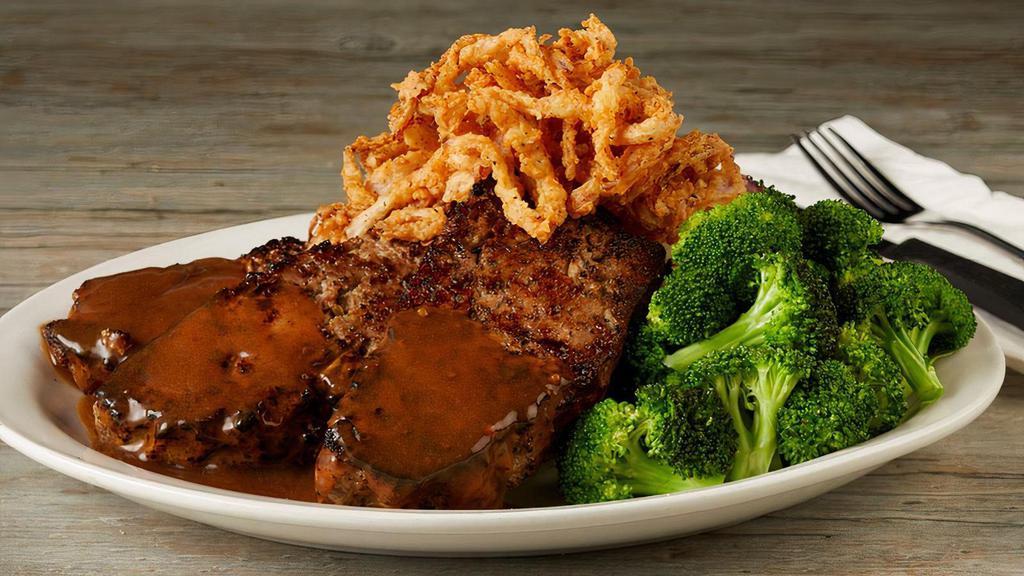 Dad'S Homemade Meatloaf · Housemade signature blend of ground sirloin, bell peppers, onions, oregano and basil, served with mashed potatoes & brown gravy, topped with crispy onion rings., seasonal vegetable.