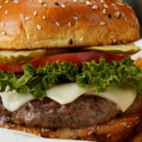 Classic Cheeseburger* · Melted white American cheese, green leaf lettuce, beefsteak tomato, dill pickle.