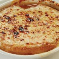 French Onion Soup · Caramelized onions, sherry, beef broth, melted Provolone cheese, toasted crouton.