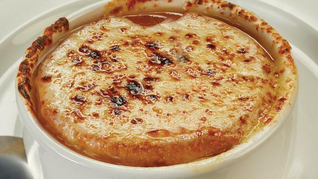 French Onion Soup · Caramelized onions, sherry, beef broth, melted Provolone cheese, toasted crouton.