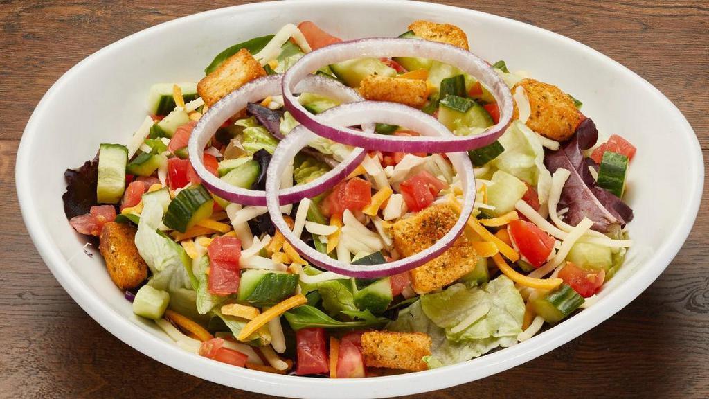 House Salad · Roma tomatoes, cucumbers, red onion, Monterey Jack and cheddar cheeses, croutons, field greens.