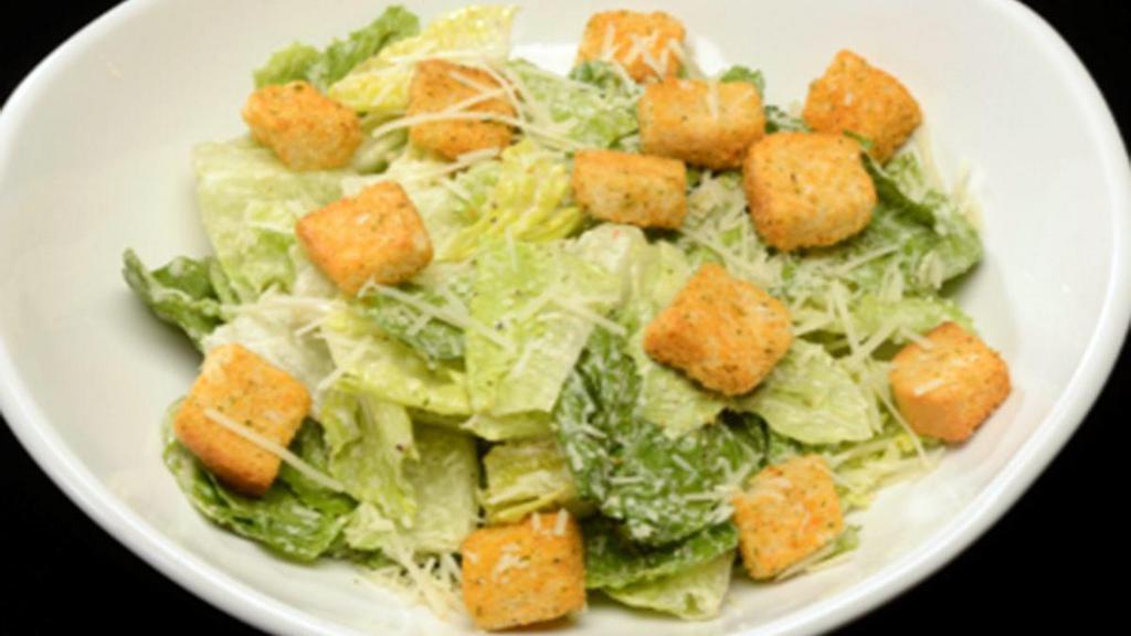 Caesar Salad · Shredded Parmesan, croutons, crisp romaine, Caesar dressing.