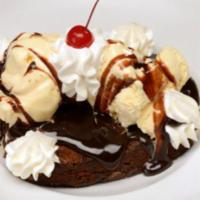 Ghirardelli® Chocolate Brownie Sundae · Served warm with vanilla ice cream, hot fudge sauce.
