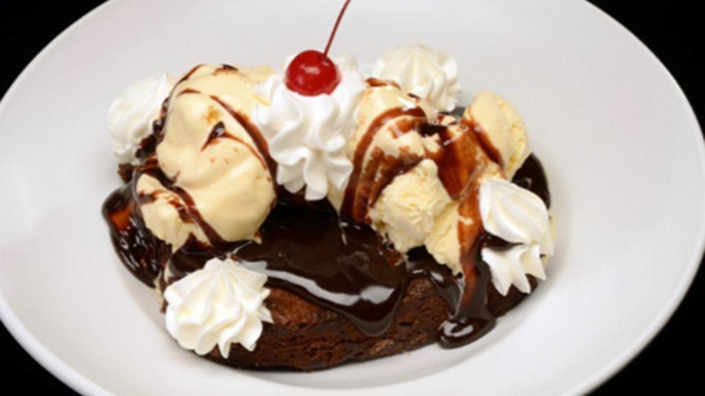 Ghirardelli® Chocolate Brownie Sundae · Served warm with vanilla ice cream, hot fudge sauce.