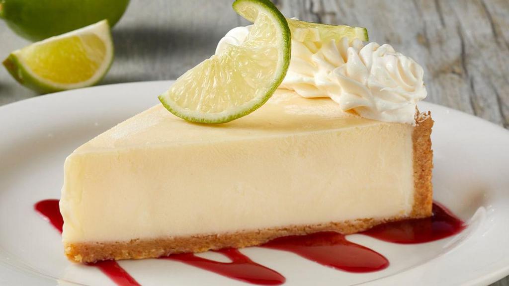 Key Lime Pie · Graham cracker crust, fresh lime and garnished with raspberry puree.
