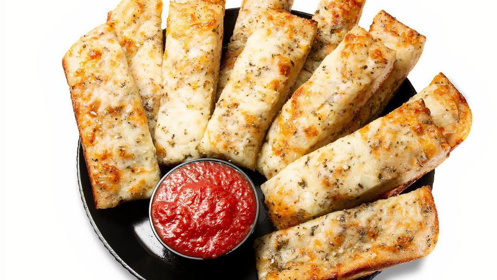 Cheesey Yummy Bread Sticks · 12 pc Oven baked garlic buttered breadsticks topped with seasonings, and Parmesan, cheddar and mozzarella cheese. Served with pizza sauce for dipping.