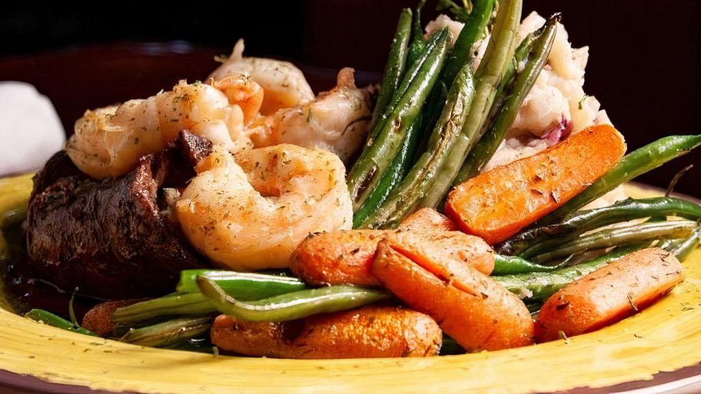 Steak And Shrimp · Grilled Skirt Steak and Caribbean Shrimp with mashed potatoes and mixed vegetables.